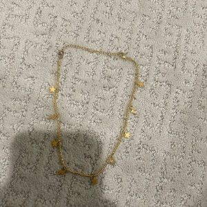 Gold star and lightning bolt necklace